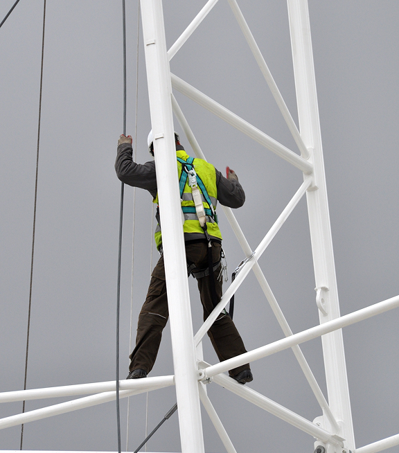 Worker performing elevated field operations